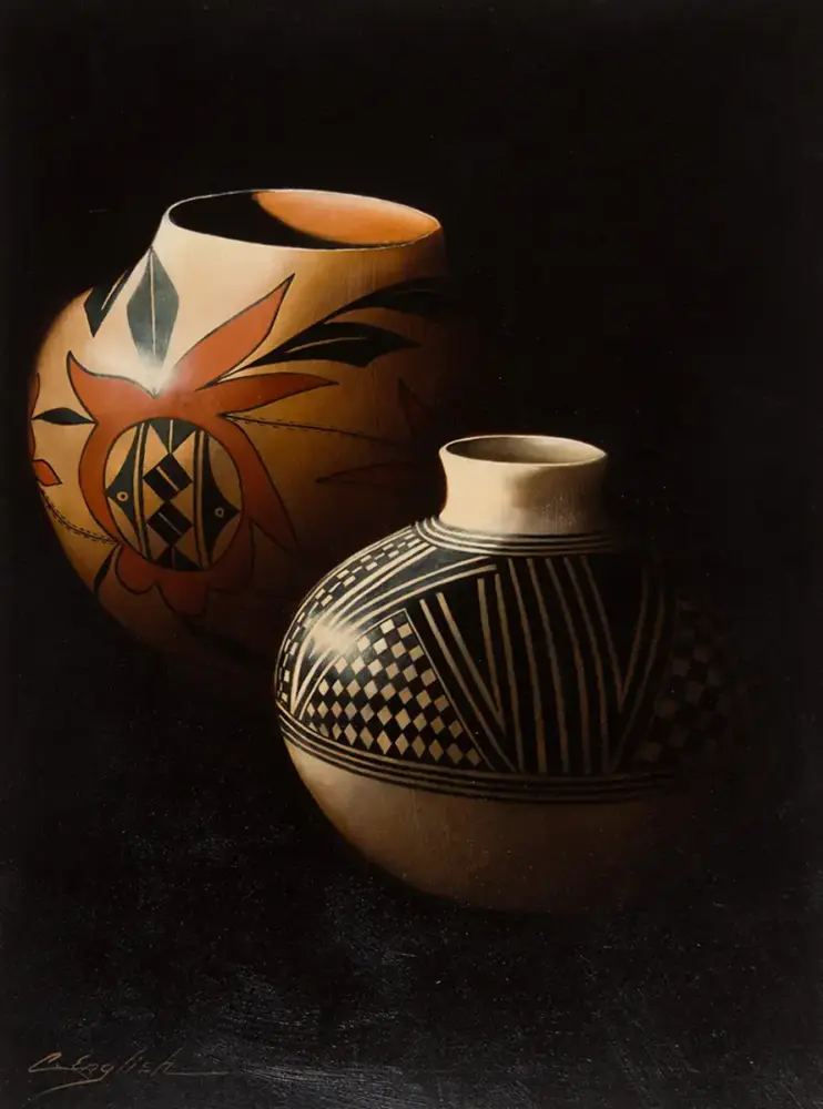Two ceramic vases on a dark background; one black-and-white geometric patterned pot and a larger orange pot with a floral design.