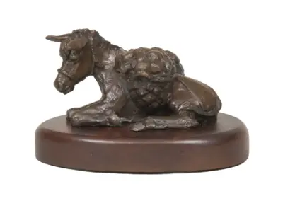 Bronze horse statue kneeling on a round wooden base with a dark brown patina