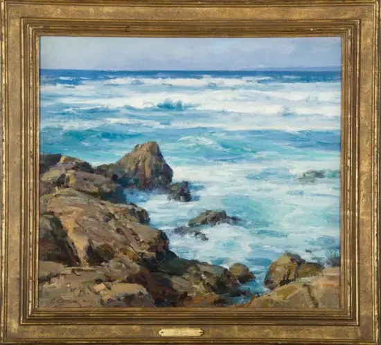 Rugged rocky coastline with turquoise waves crashing against rocks, under a cloudy sky; sea spray and whitecaps dominate the scene.
