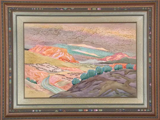 Colorful desert landscape painting with rolling pink, orange, and blue hills in a decorative multi-layer frame.