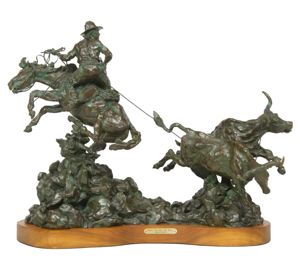 Bronze equestrian statue of a rider on a rearing horse, with a lariat, mounted on a wooden base with a plaque.