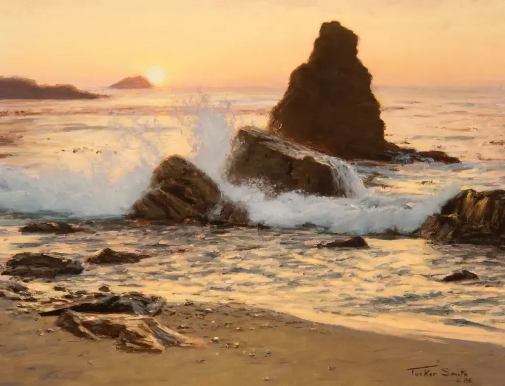 Sunset over a rocky shoreline with waves crashing against tall sea stacks.