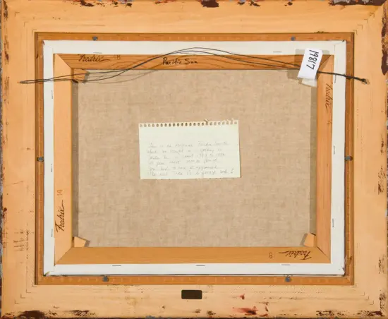 Back of a framed canvas showing wooden stretcher bars, beige canvas, a hanging cord, and a small handwritten note attached in the center.