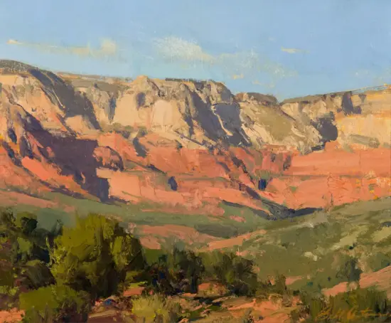 Impressionist landscape of red cliffs, green shrubs, and a blue sky.
