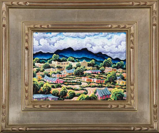 Colorful hillside village painting with terraced houses, green trees, and distant blue mountains under a cloudy sky, in a gilded frame.