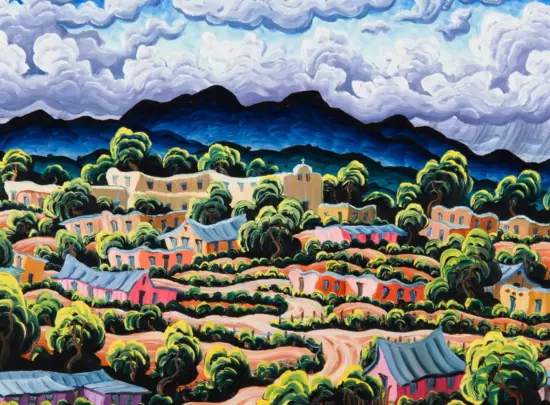Colorful hillside village with warm-toned houses, abundant greenery, and a blue mountain range under a cloudy sky.