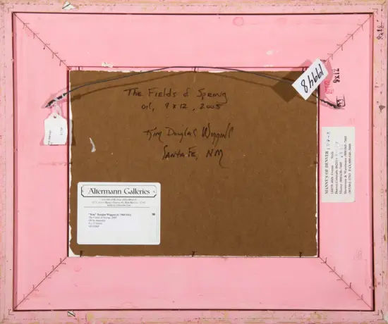 Back of a pink framed artwork on brown mat; handwritten title 'The Fields of Spring' (oil, 9x12, 2005) and artist Tim Douglas Wiggins, Santa Fe, NM, with gallery tags.