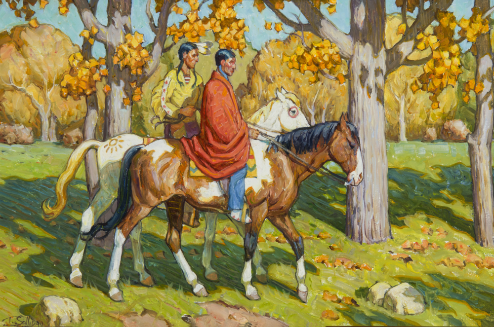 Two riders on horseback ride through a sunlit autumn forest with yellow leaves on the trees and ground.