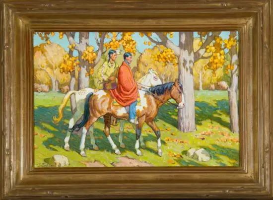 Two riders on horses ride through an autumn forest with gold leaves on the trees.