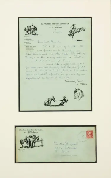 Framed handwritten letter with Western-themed sketches (cowboys on horseback) displayed on a light wall.