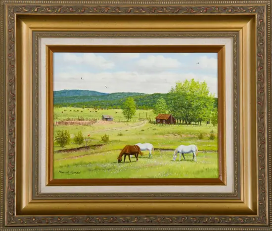 Rural landscape painting: horses grazing in a green field with a wooden barn, trees, and distant hills under a blue sky, framed in an ornate gold frame.