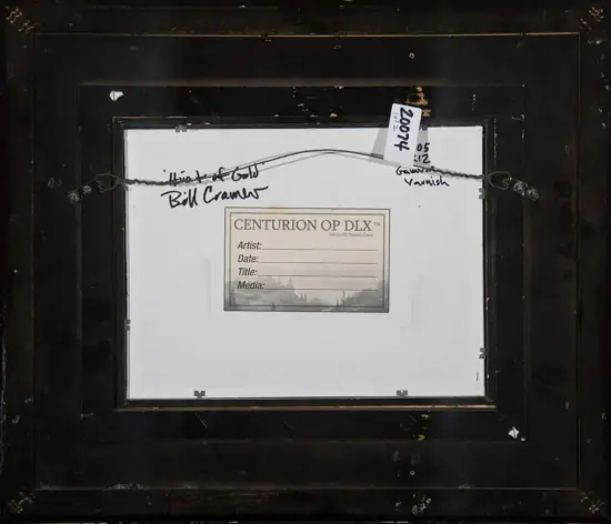 Back of a framed artwork with a hanging wire and label reading 'CENTURION OP DLX' with fields for artist, date, title, media; handwritten notes on the edges.