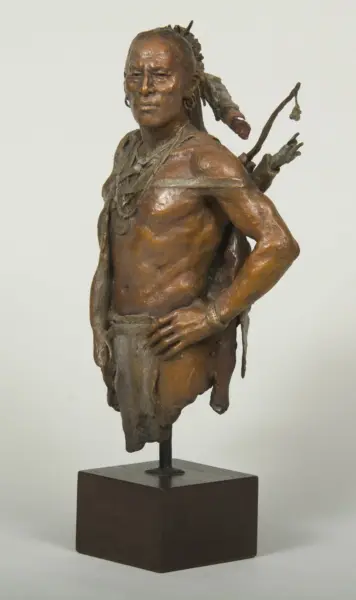 Bronze sculpture of a Native American man with a bow on his back, shirtless, standing with one hand on his hip on a square pedestal