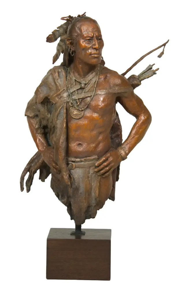 Bronze sculpture of a Native American man with beads, standing with hands on hips, bow and quiver on his back, mounted on a wooden pedestal.