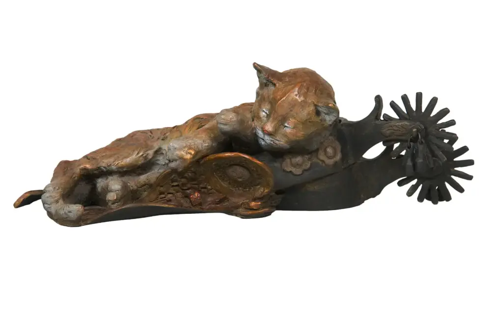Bronze sculpture of a reclining, textured animal with a radial, spoked form at its rear end.