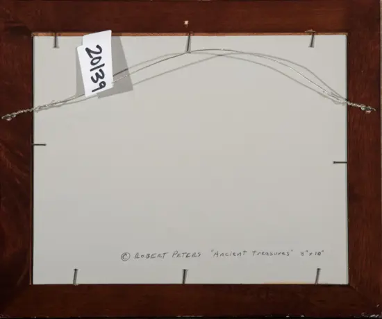 Back of a framed artwork showing a braided hanging wire and a small tag, with a handwritten caption reading © Robert Peters 'Ancient treasures' 8x10.