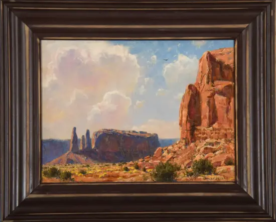 Oil painting of a desert landscape with red rock cliffs on the right, a distant blue sky with clouds, and dark mesas on the left, in a wide frame.
