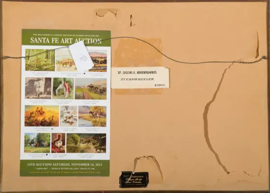 Back of a brown folder with a Santa Fe Art Auction flyer taped on; small art thumbnails are visible on the flyer.