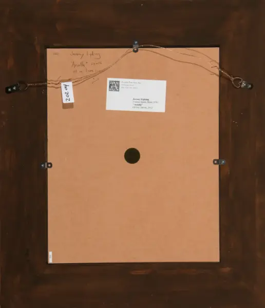 Back of a framed artwork: brown wood frame with hanging wire, small white tag labeled 2020, and a label card attached to the back.