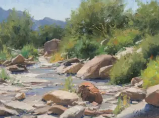 Impressionist landscape: a rocky stream with water weaving around large stones and lush green trees in the background.
