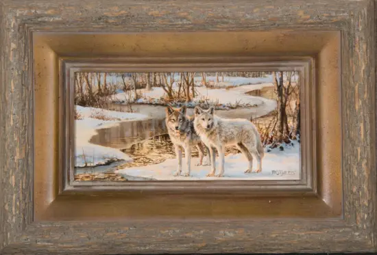 Winter scene painting of two wolves standing by a partially frozen stream in a snowy forest, within a weathered wooden frame.