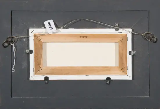 Back of a framed artwork on a dark wall, showing the hanging wire, metal hardware, and a white tag with a number attached to the frame edge.