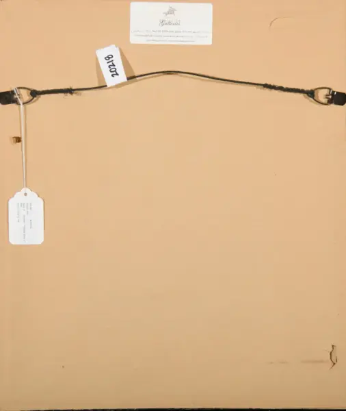 Back of a framed artwork showing a braided black hanging wire, metal hooks, and white tags with numbers (e.g., 2018) on a beige board.