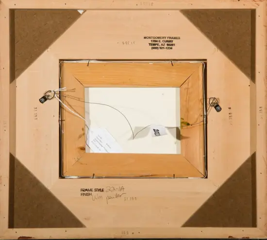 Back of a framed painting, showing wooden frame, hanging wire, and labeled notes with finish and frame style written on the stretcher.