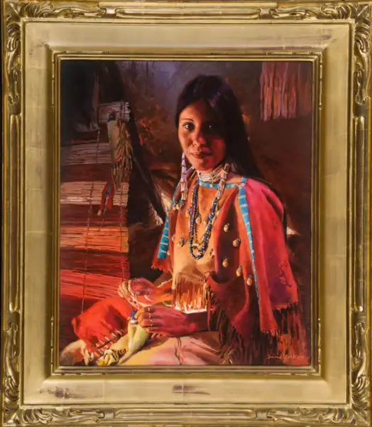 Portrait of a Native American woman in beadwork, weaving at a loom, framed by a gold ornate frame.