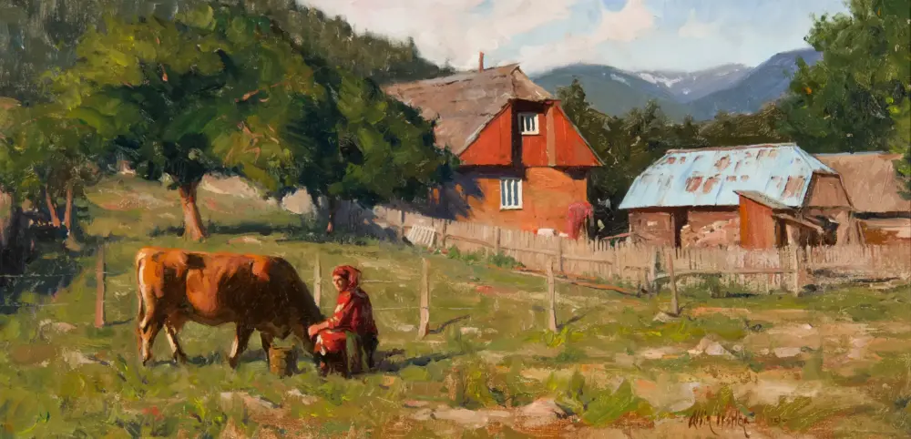 Rural scene with a person in red tending a brown cow in a grassy field near a wooden fence, farm buildings in the background. A mountain range behind trees in daylight.