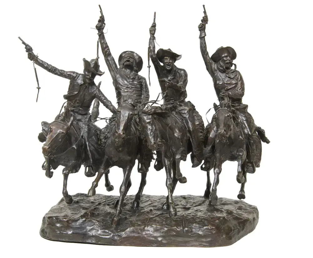 Bronze sculpture of four cowboys on galloping horses, raising pistols in the air on a rocky base