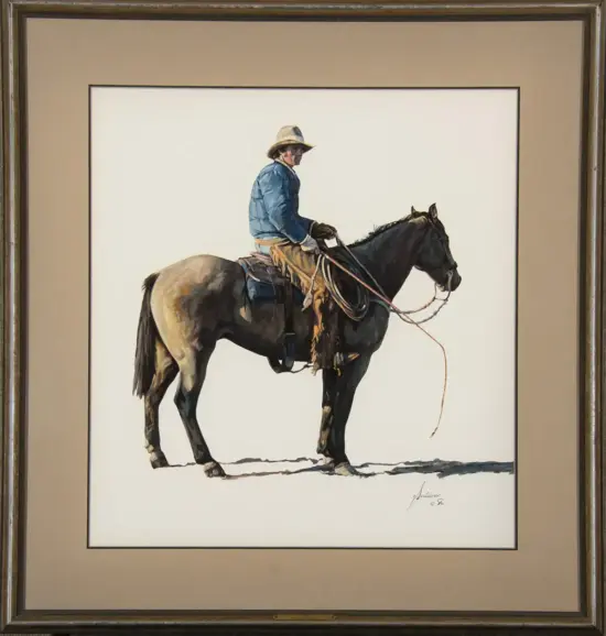 Framed painting of a cowboy in a blue jacket riding a dark horse with a saddle and rope.